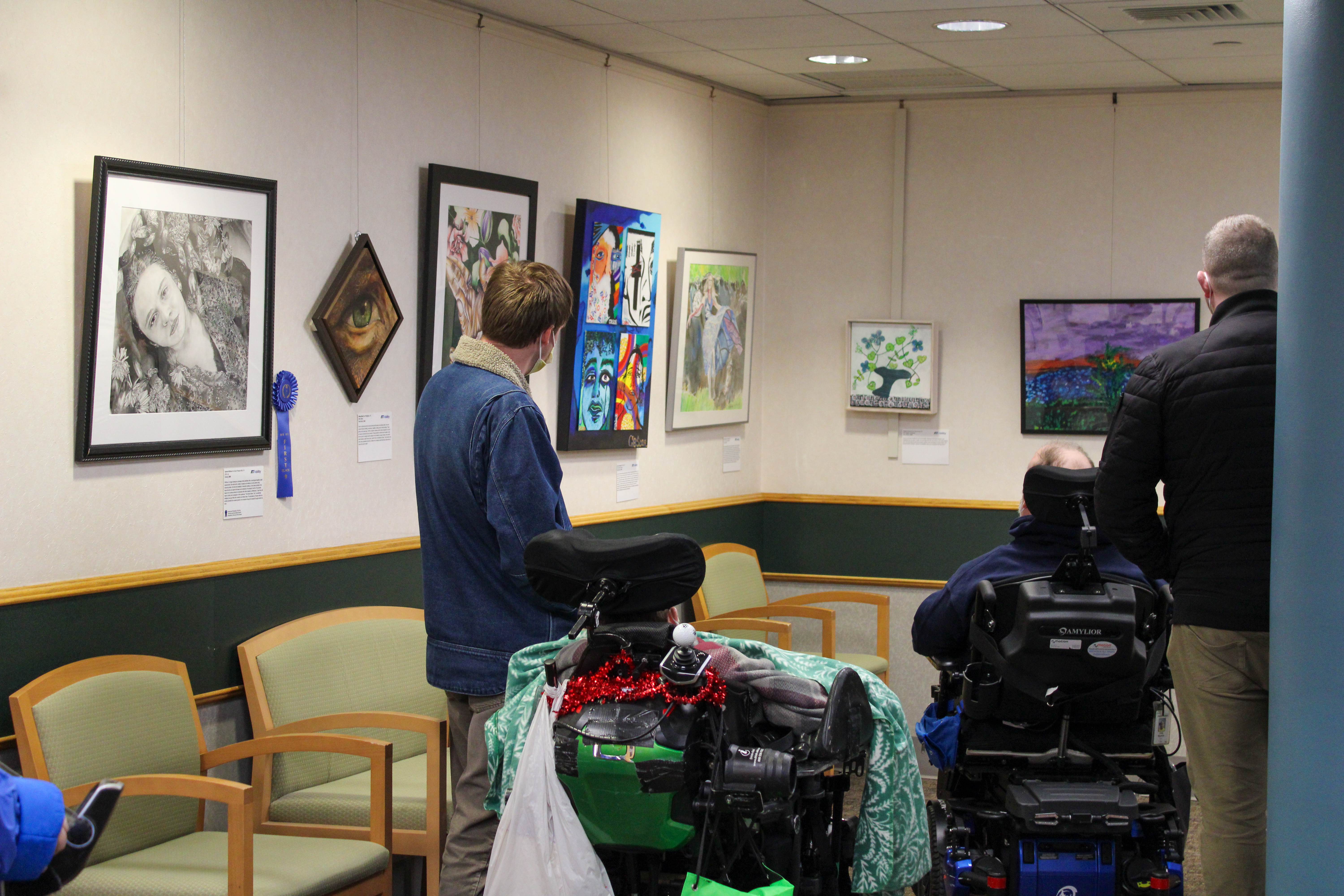 People view some of the art exhibit