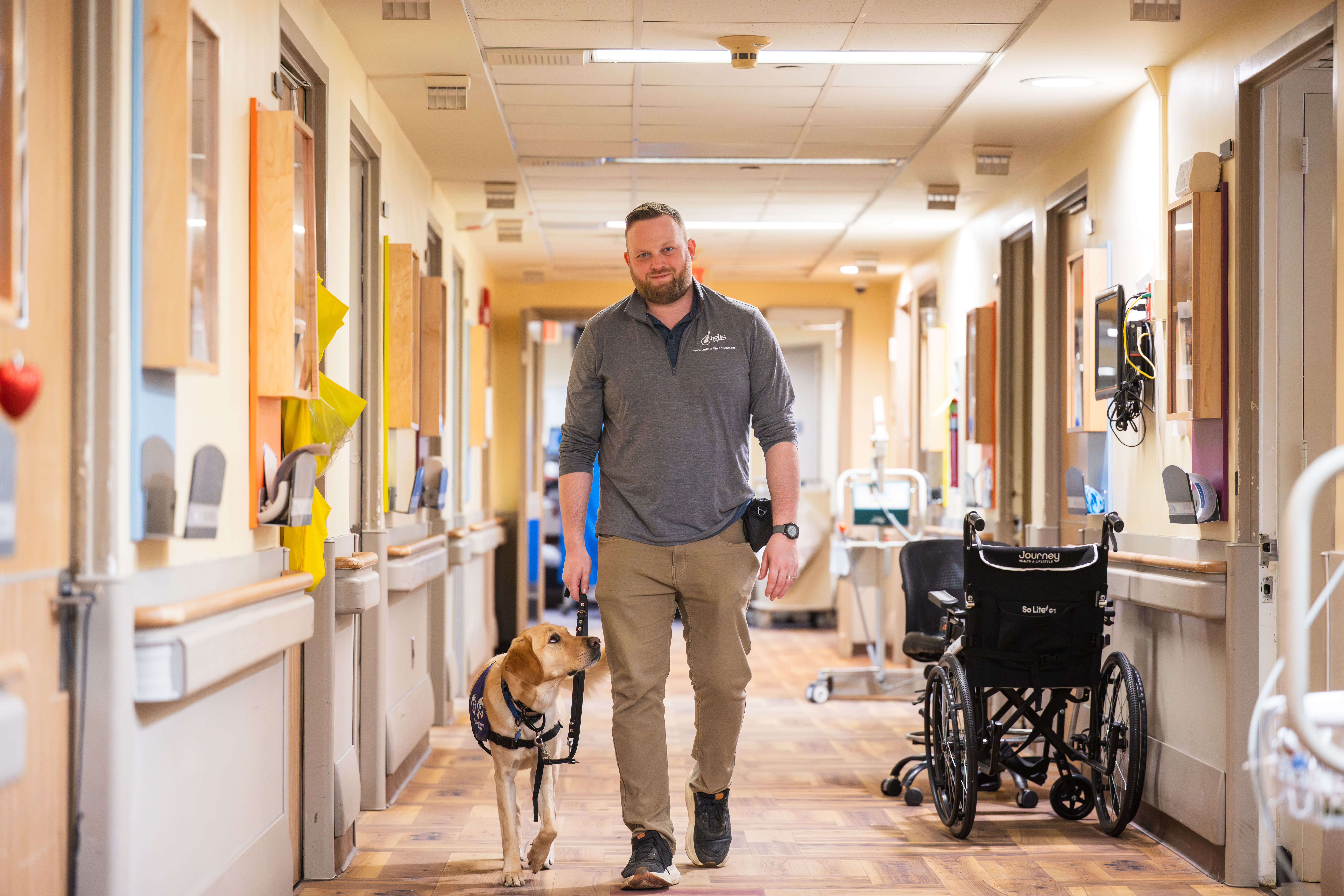 Leroy and Jeremy walk down a hall in Inglis House
