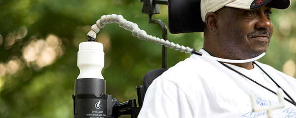 man drinking with a Drink-Aide